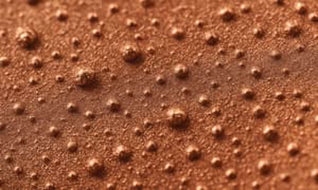 Side-by-side comparison photos of common plating defects including burning, pitting, and peeling